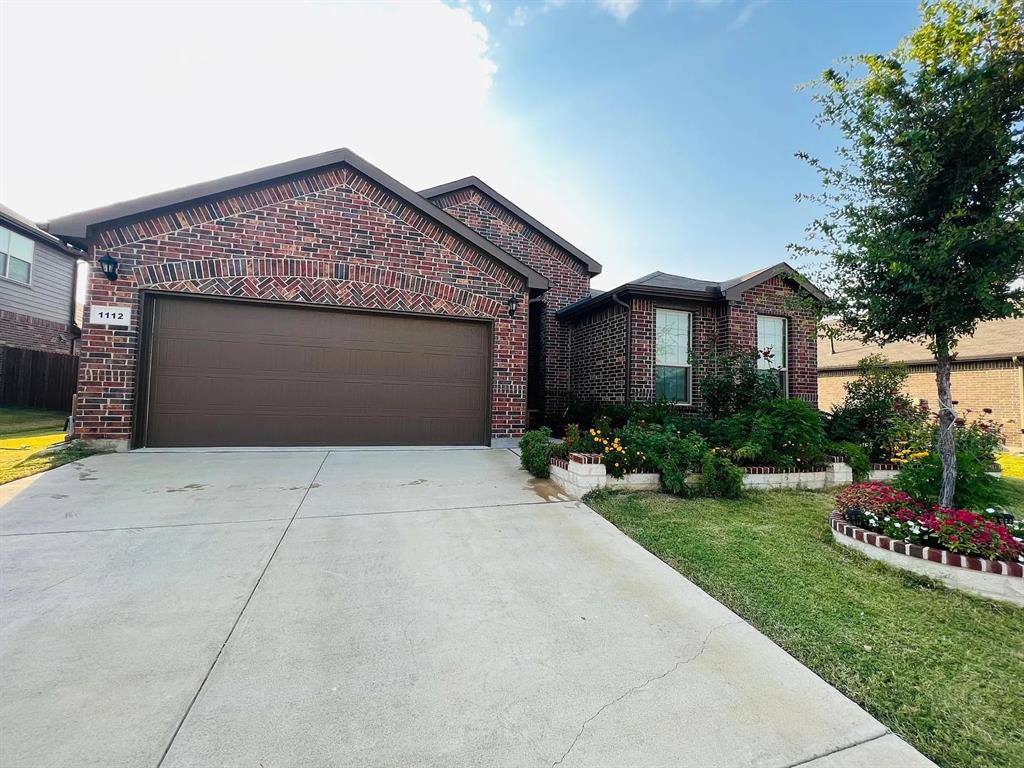 a front view of house with yard and outdoor seating