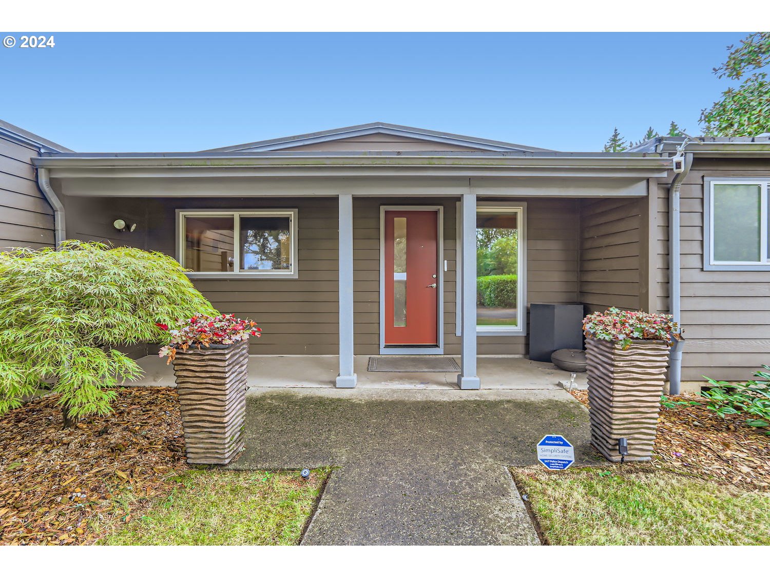 a front view of a house with a yard