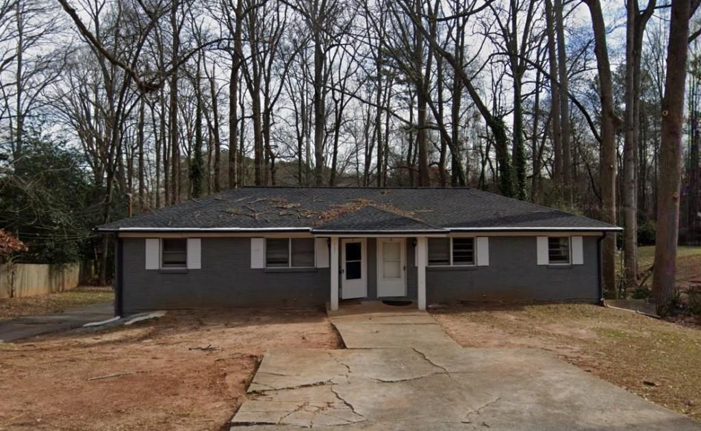 front view of a house with a dry yard