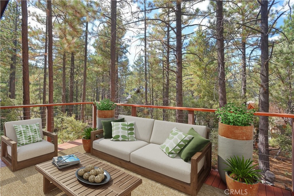 a balcony with furniture and wooden floor