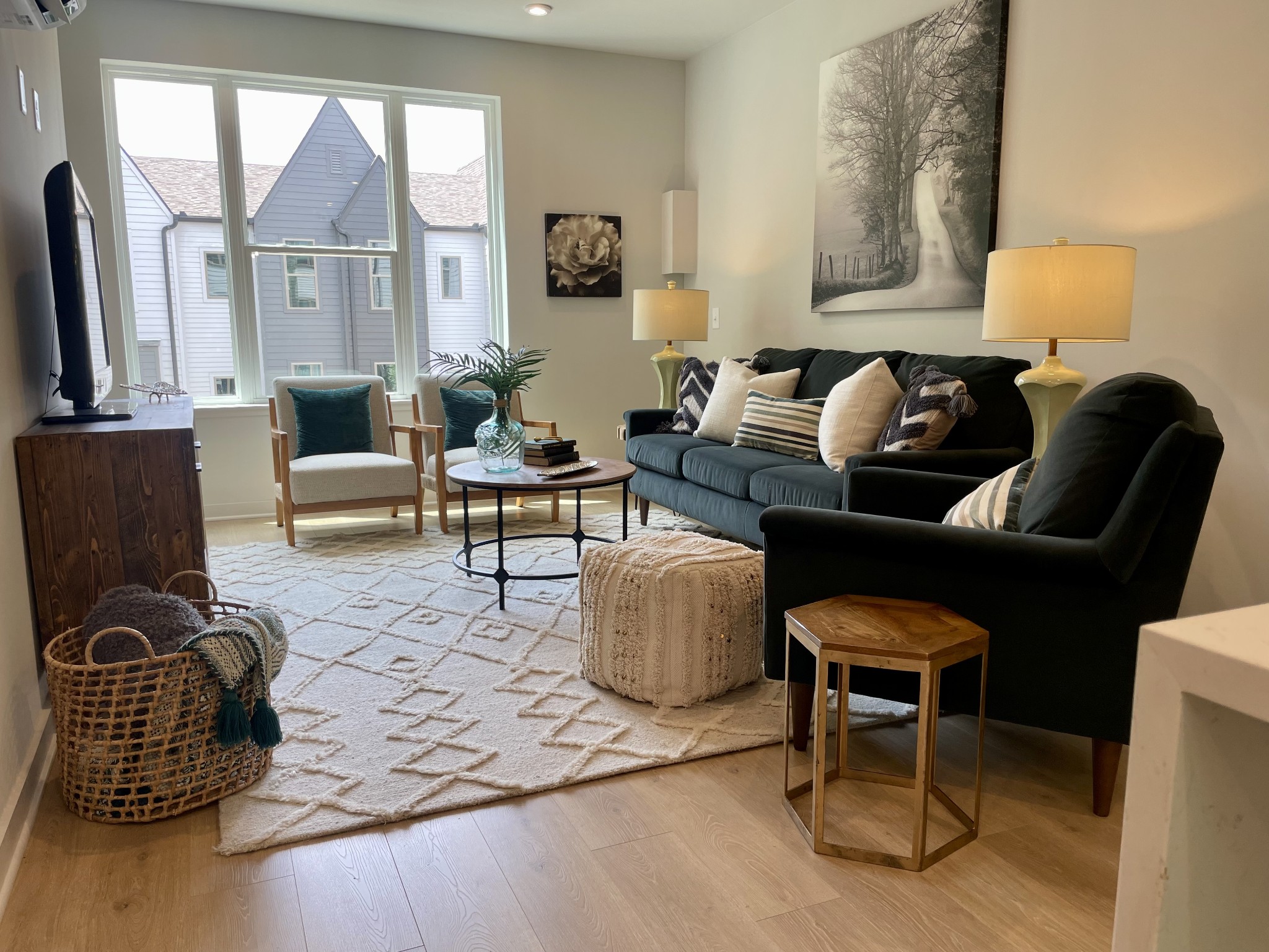 a living room with furniture and a window