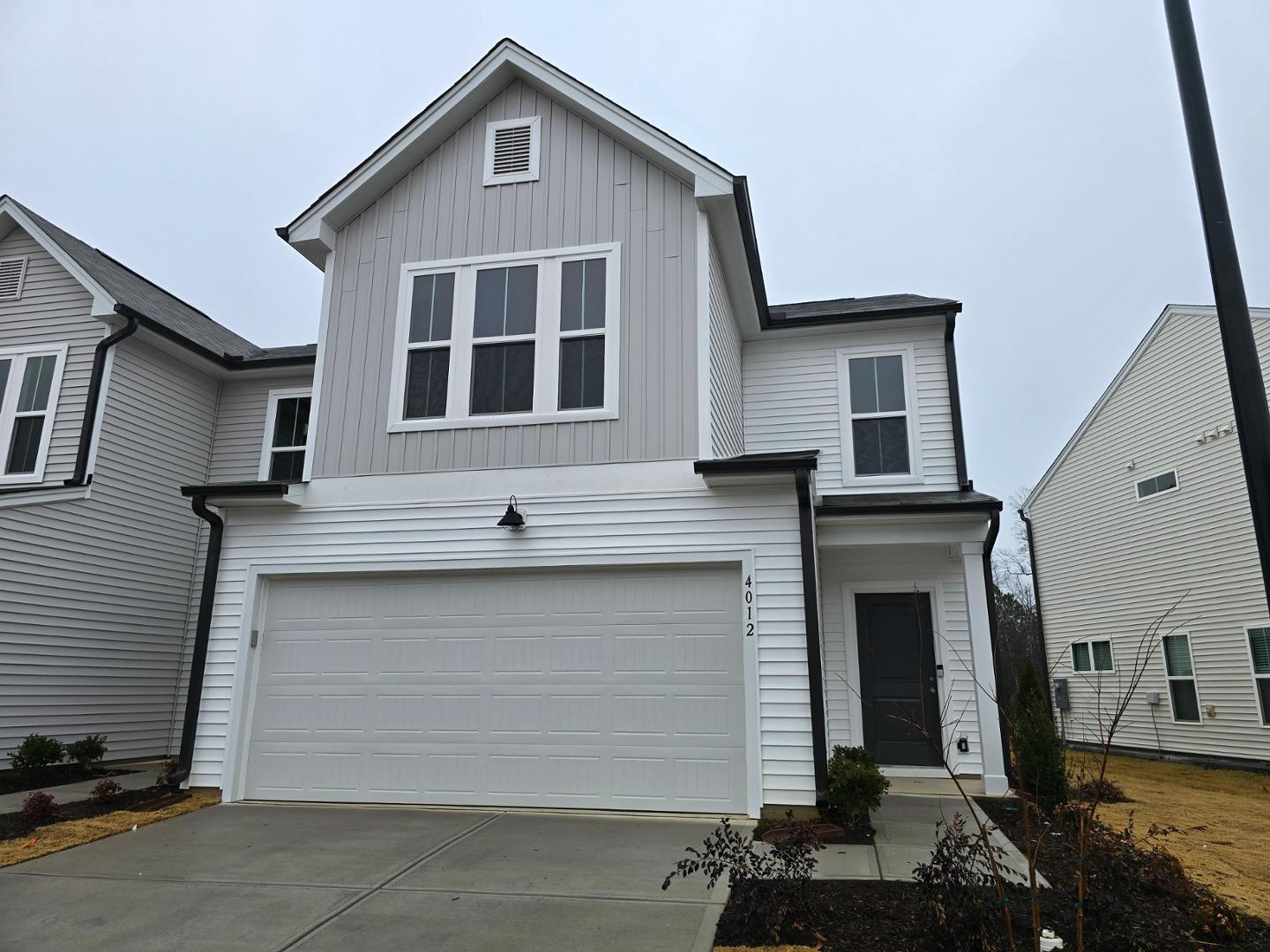 a front view of a house with a garage