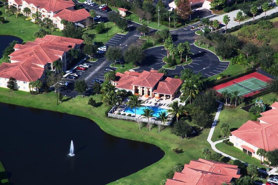 an aerial view of a house with yard swimming pool and outdoor seating