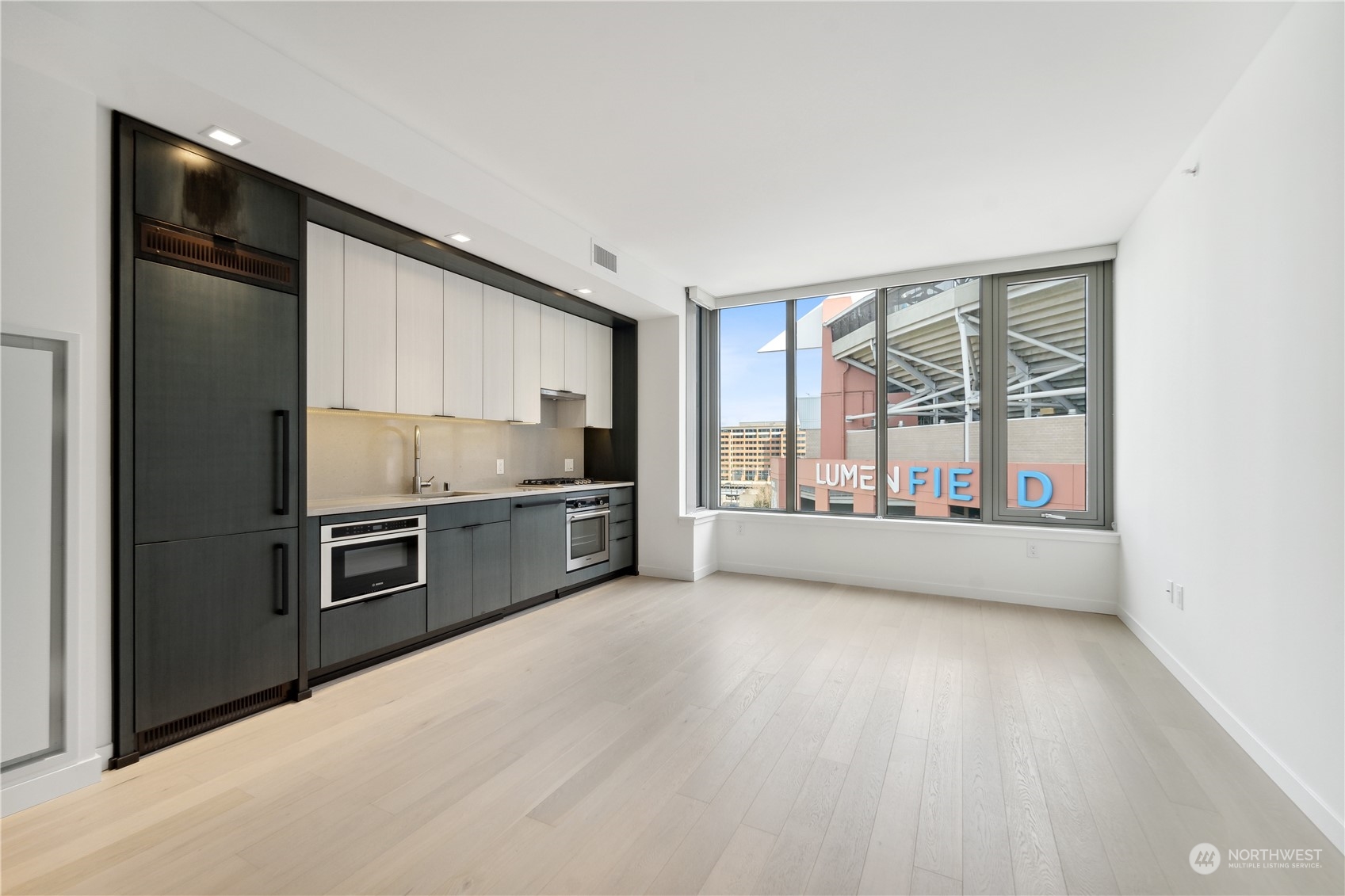 a kitchen with stainless steel appliances a refrigerator and a sink