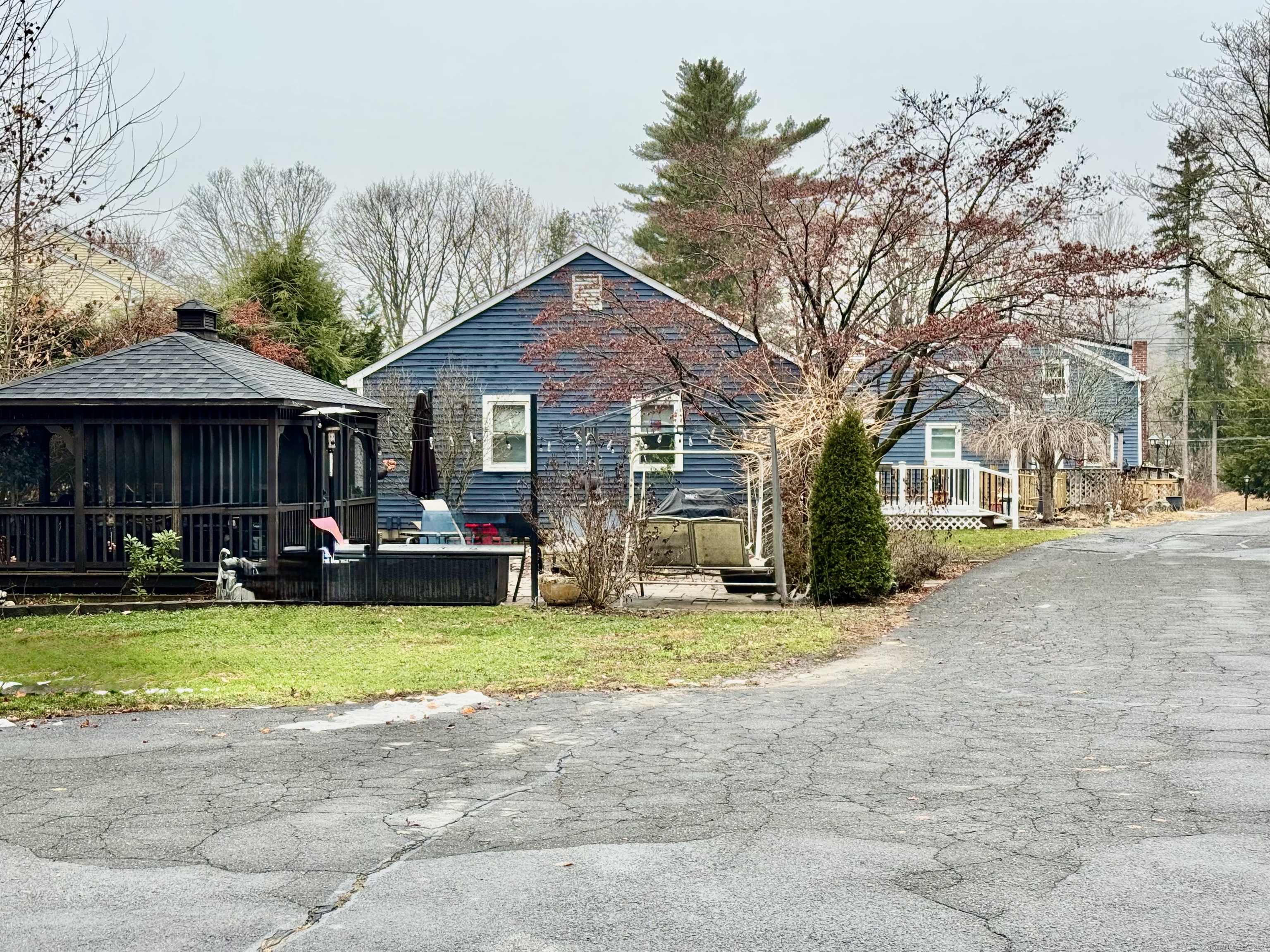 a view of a house with swimming pool and sitting area