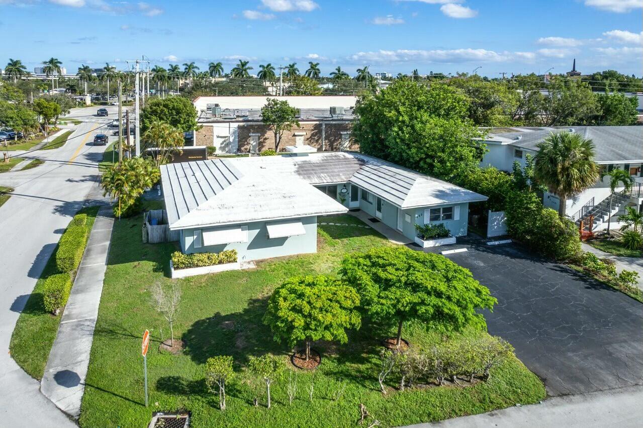 an aerial view of a house with a garden