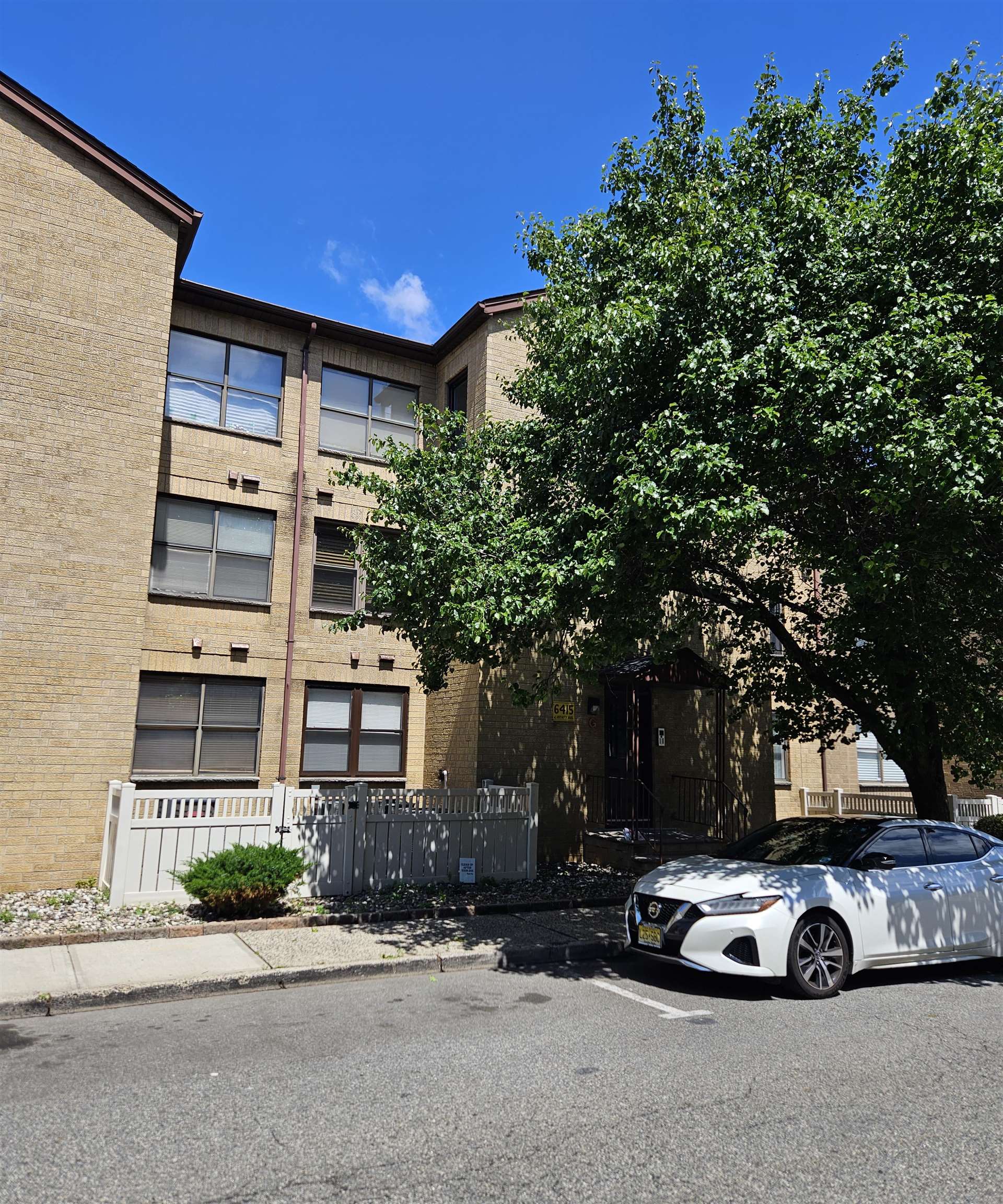 front view of a car parked in front of a building