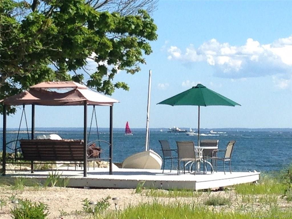 a small pool with table and chairs