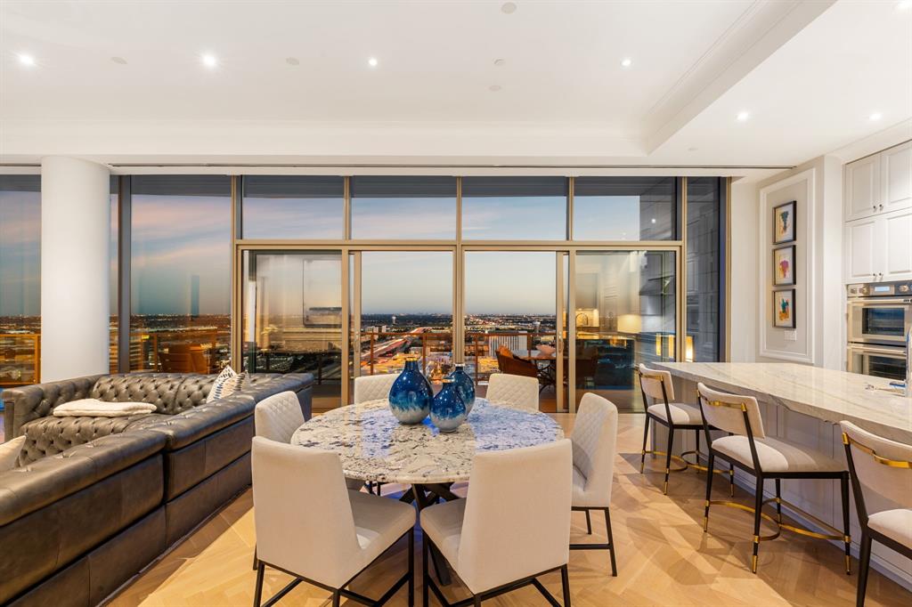 a view of a dining room with furniture water view and a large window