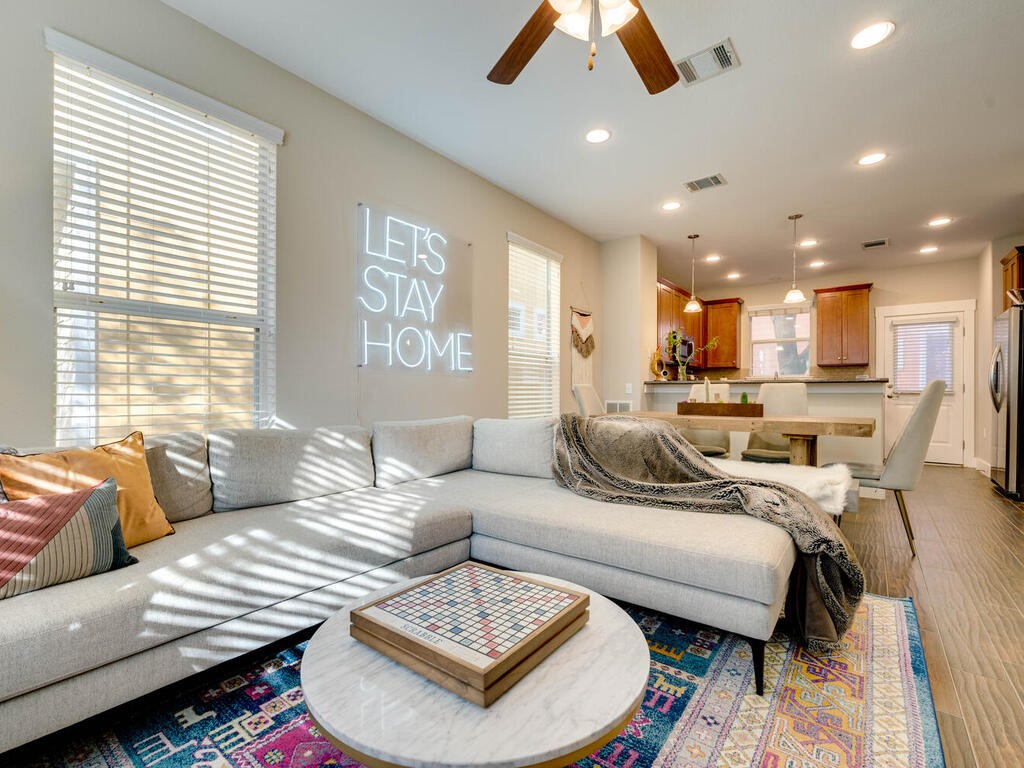 a living room with furniture and a large window