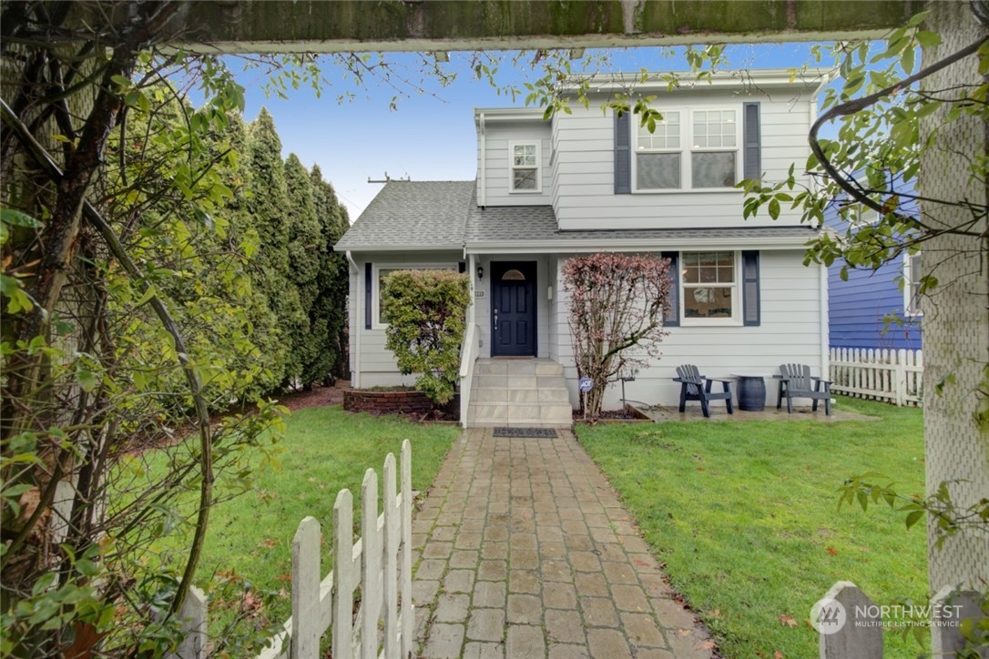 a front view of a house with a garden