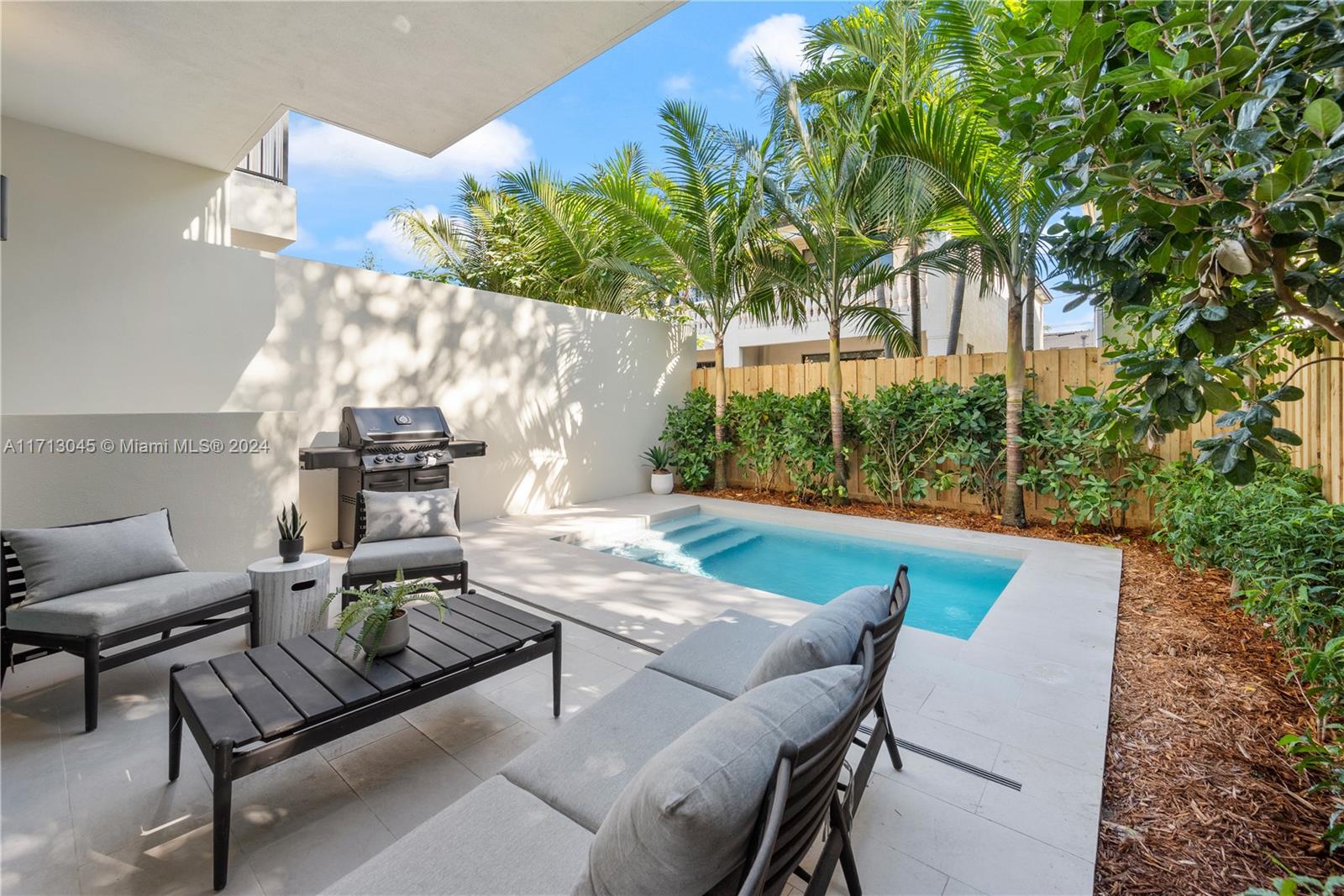 a view of an outdoor sitting area with furniture