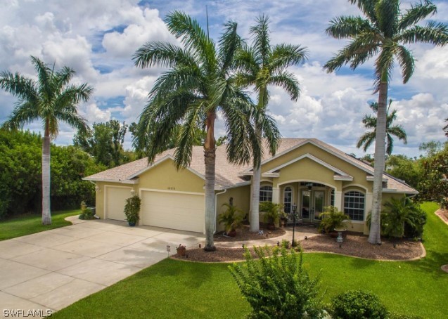 a front view of house with yard and green space