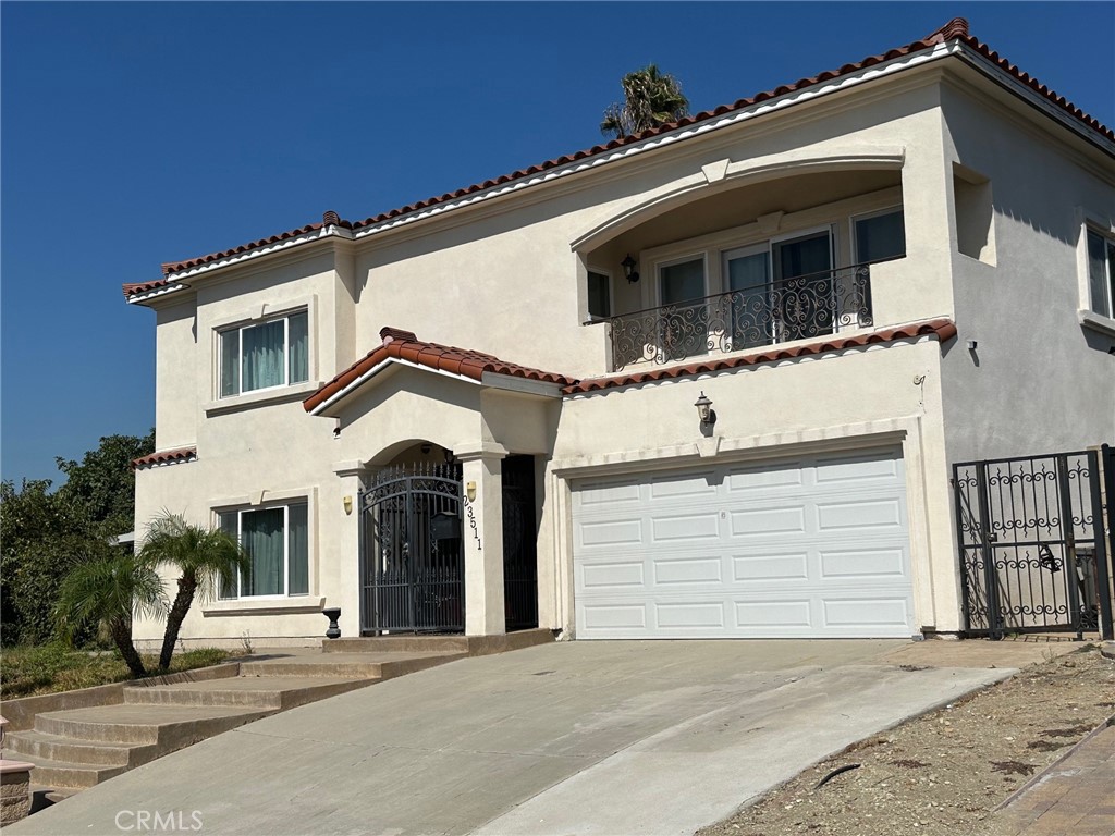 a front view of a house with a garage