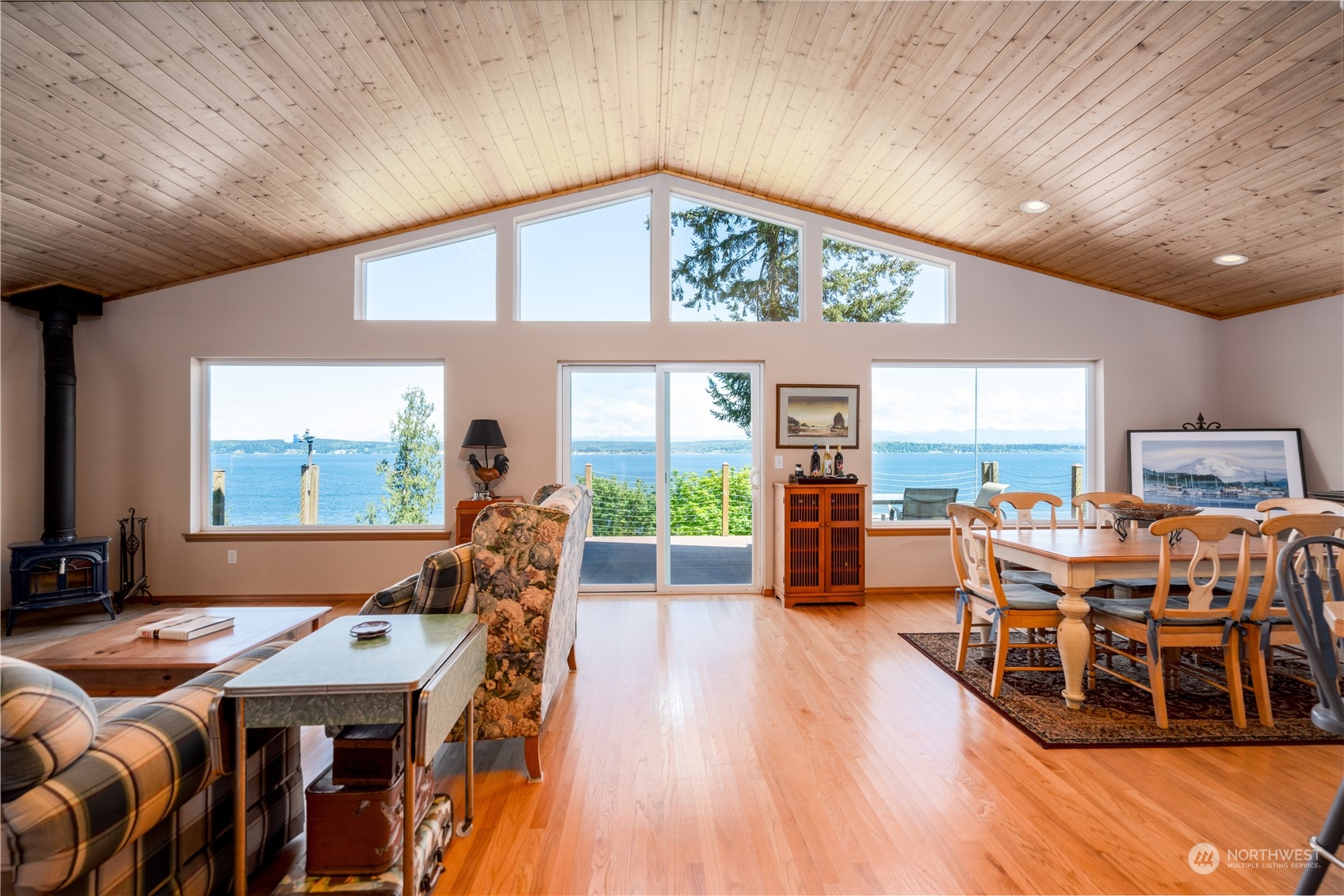 a living room filled with furniture and a large window