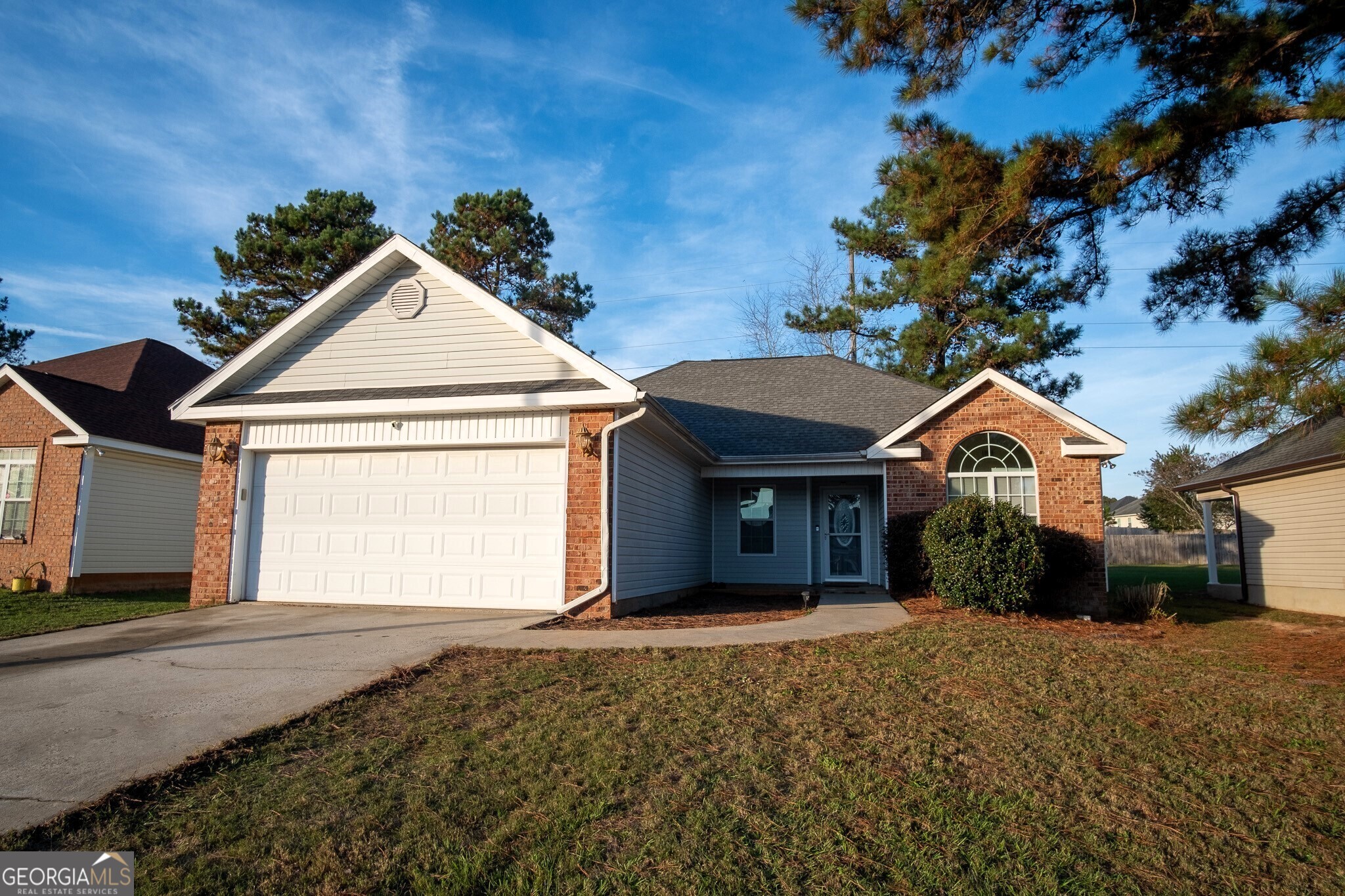 a front view of a house with a yard