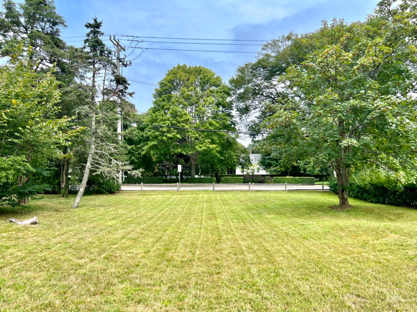 a swimming pool with trees in the background