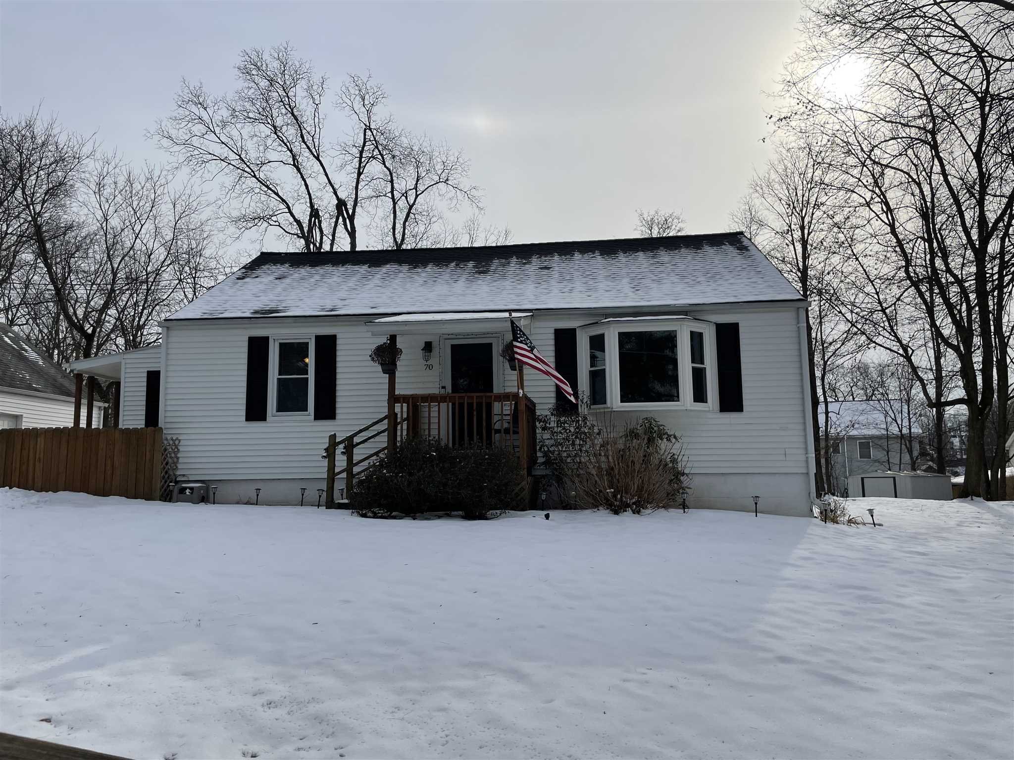 a view of house with a yard