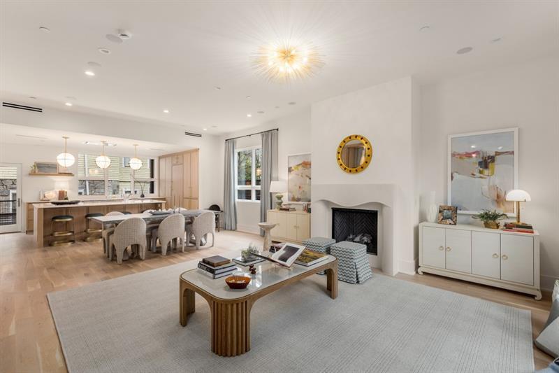 a living room with furniture and fireplace