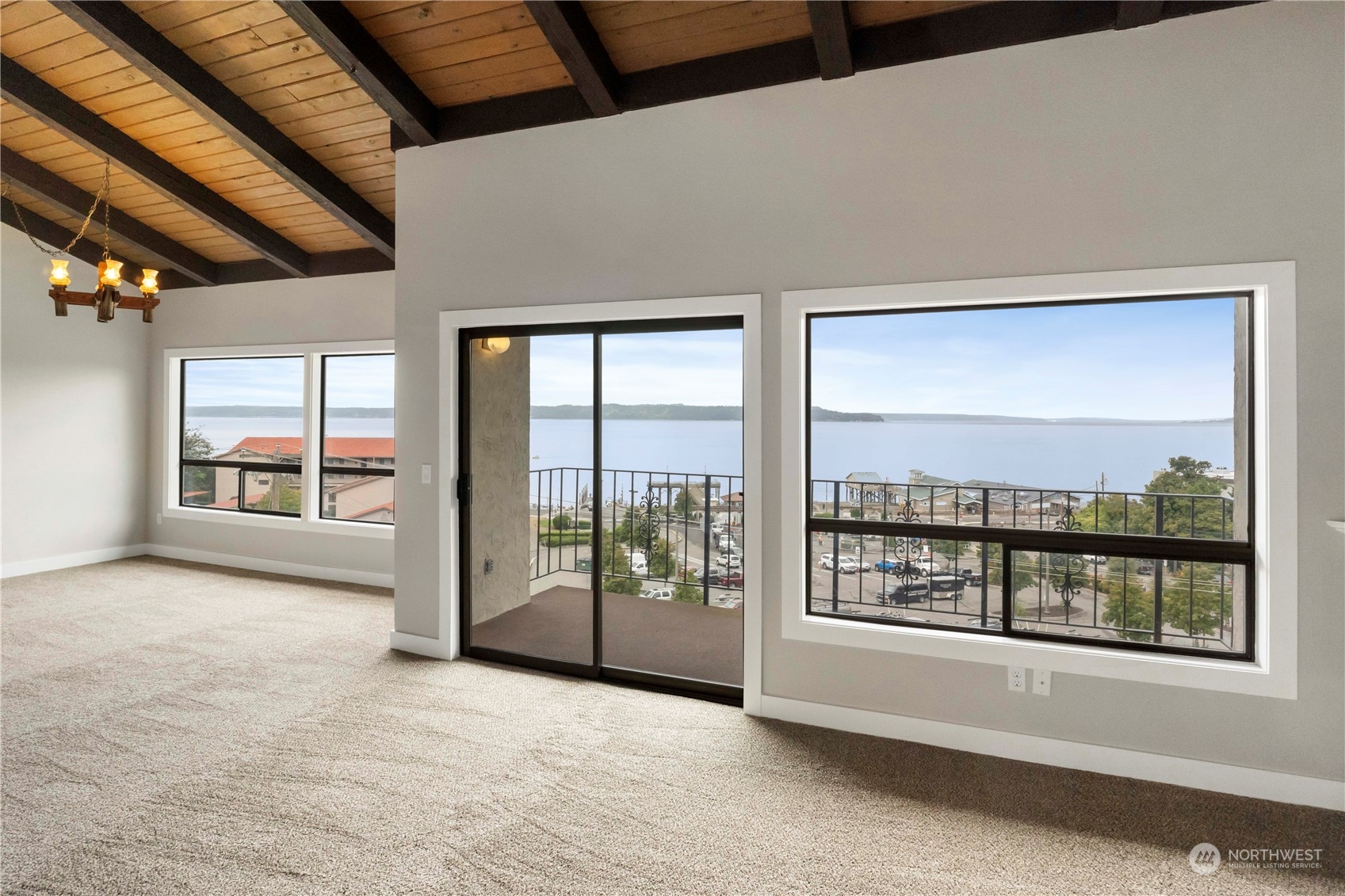 a view of an empty room with a balcony