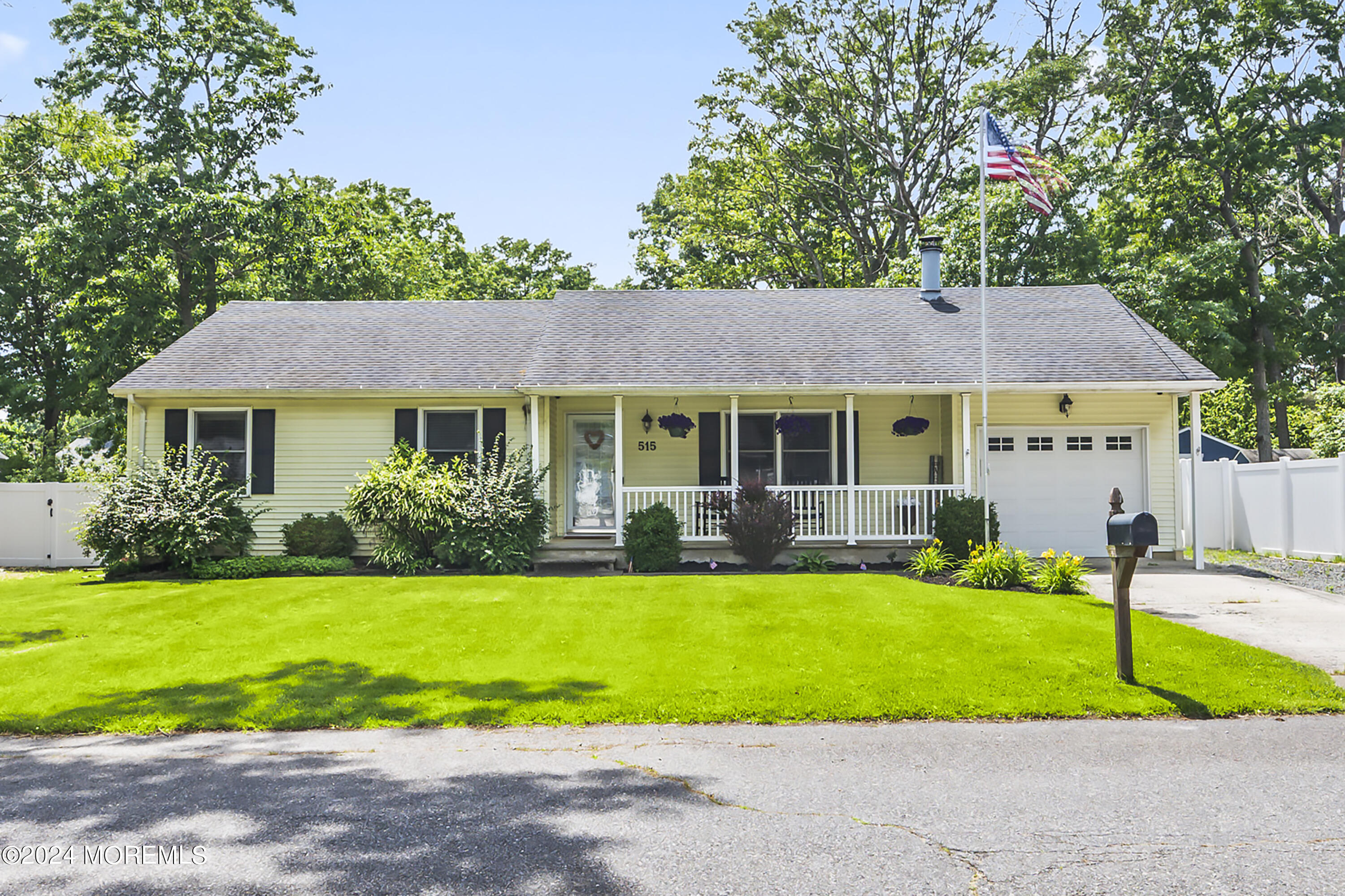 a view of a house with a yard and plants