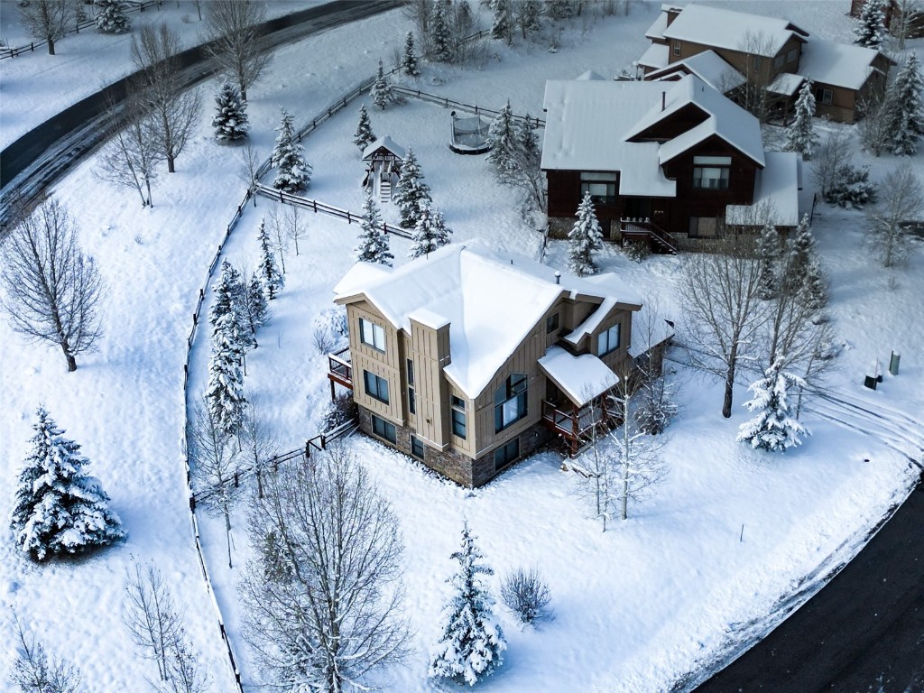 a view of a house with a snow in a yard