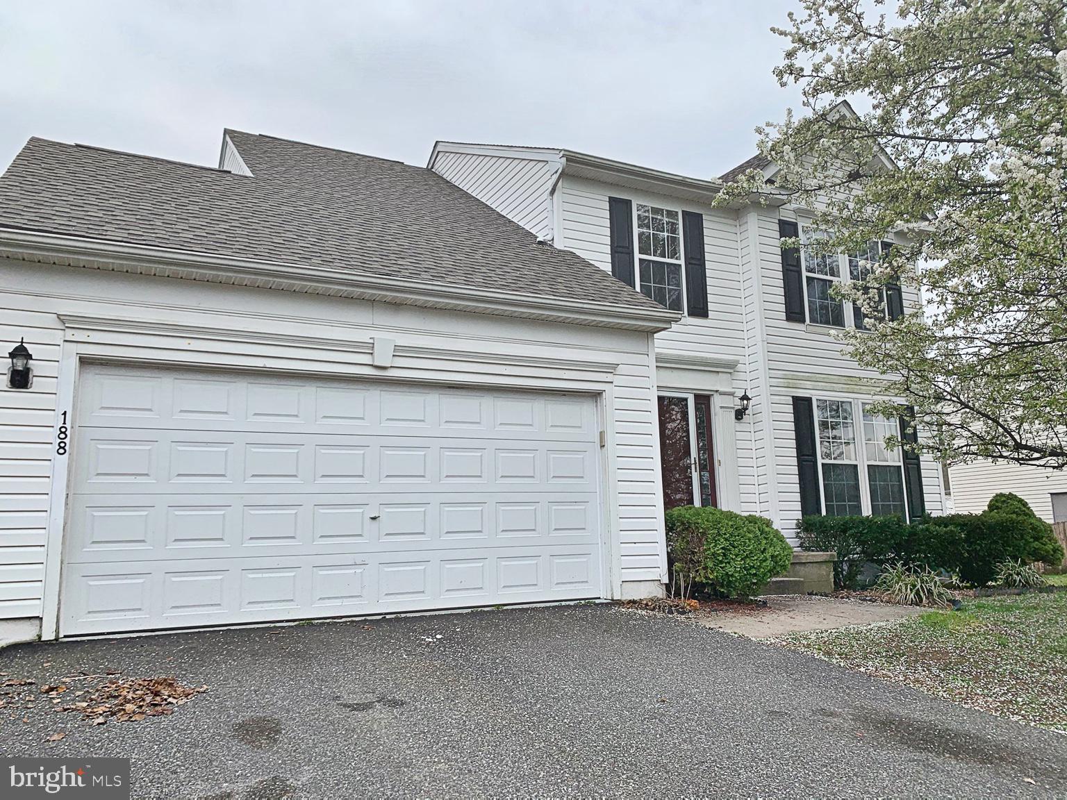 a side view of a house with a garage