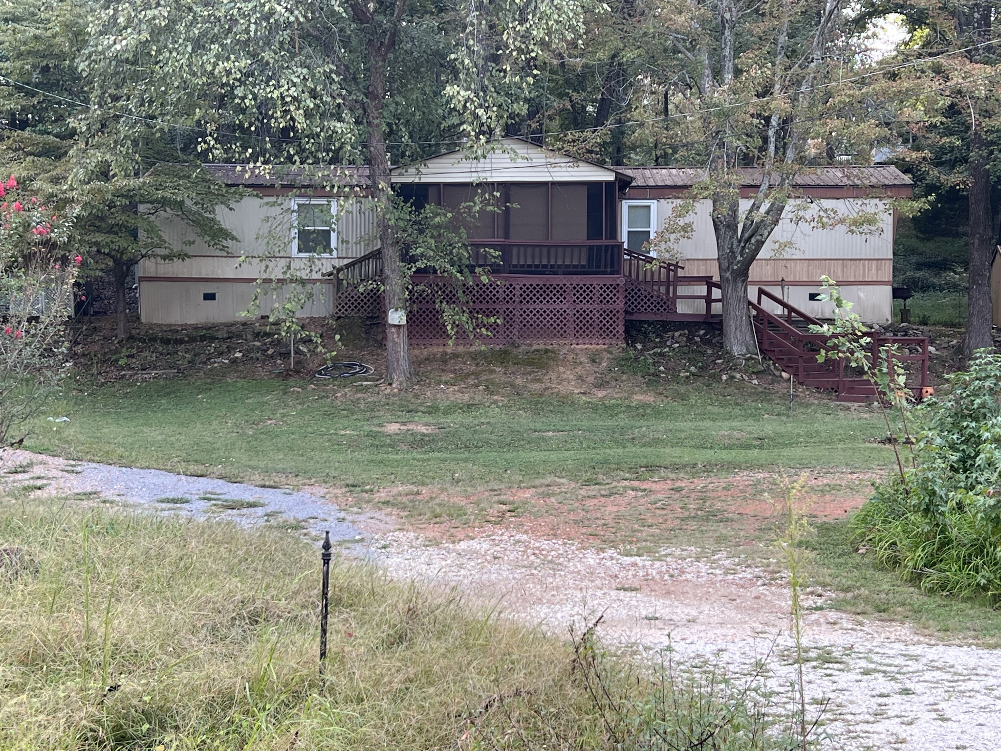 a backyard of a house with barbeque oven