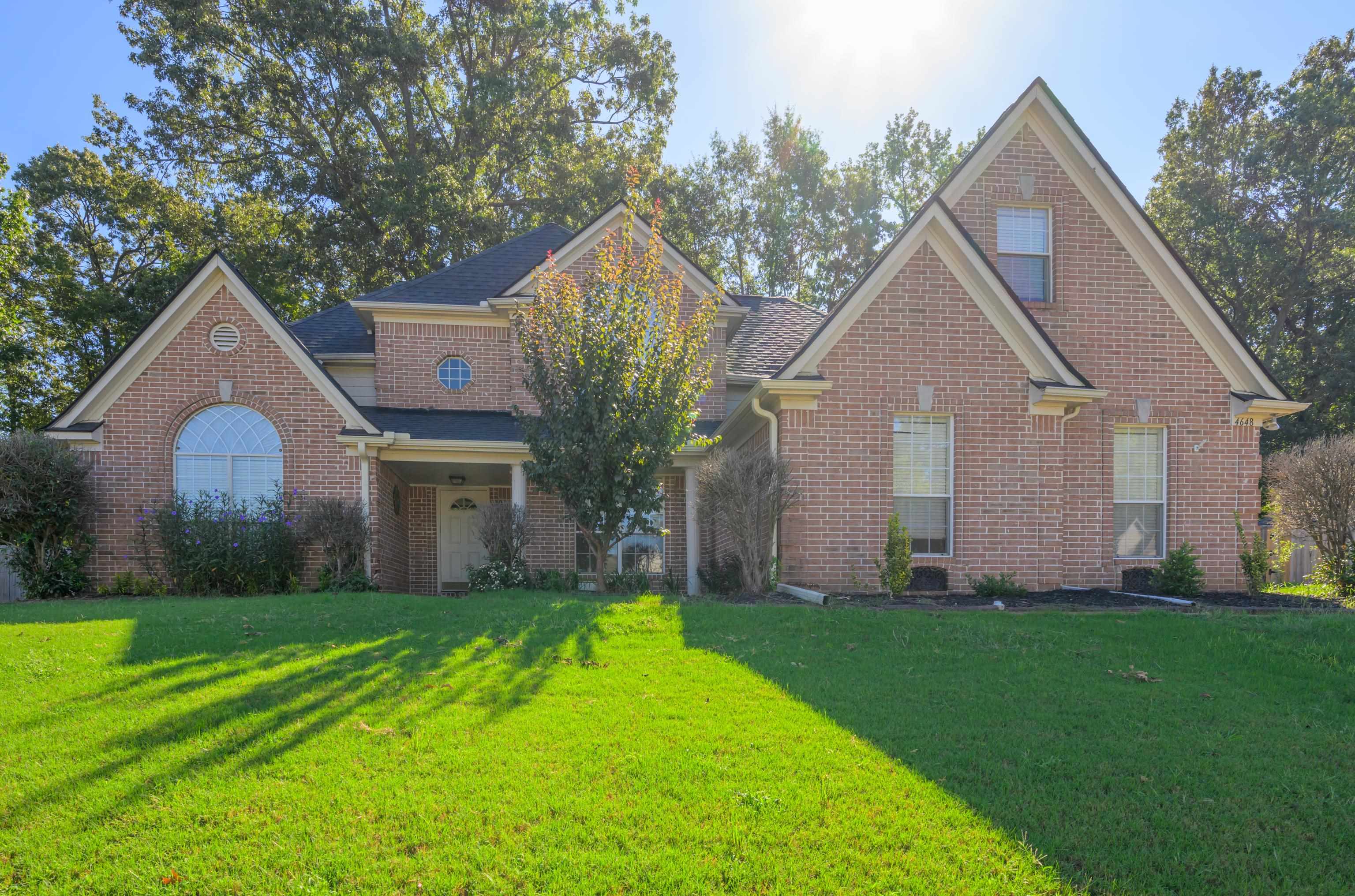 Front facade featuring a front lawn