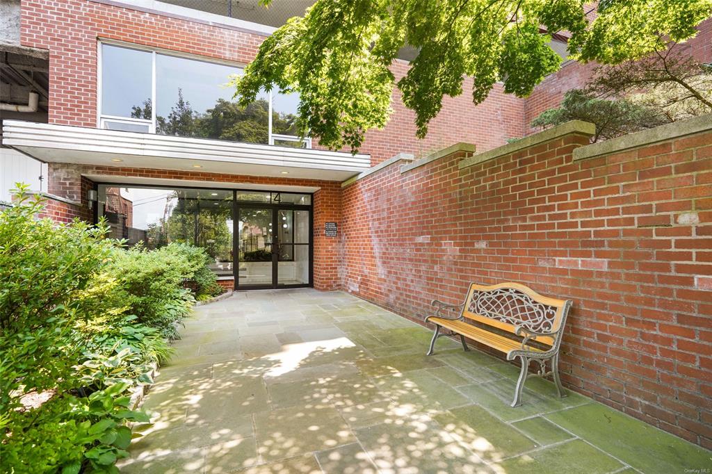 a backyard of a house with outdoor seating