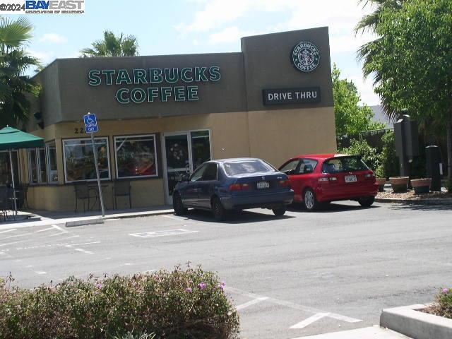 a view of a car parked in front of a building