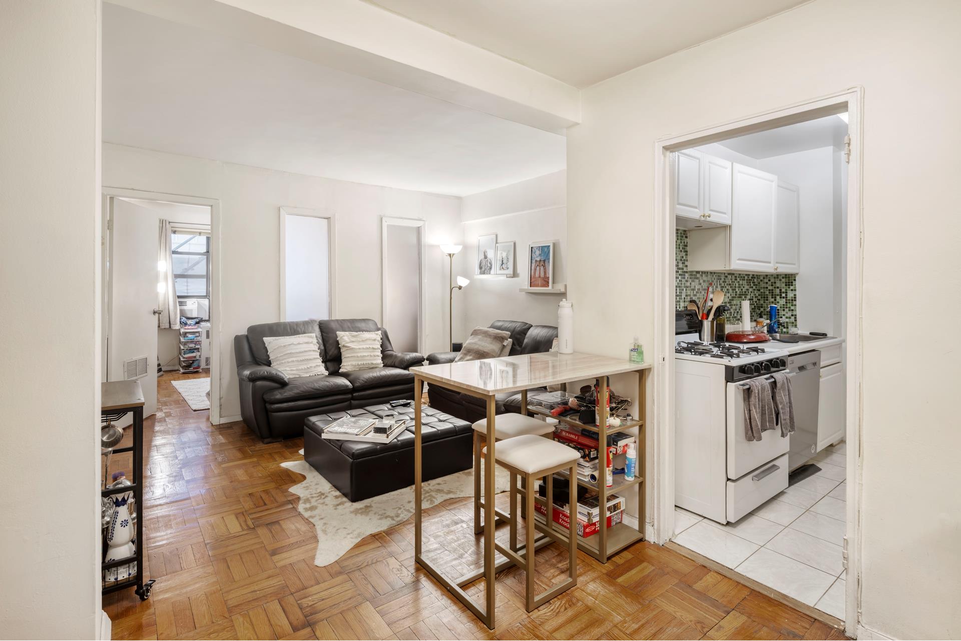 a living room with furniture and a table