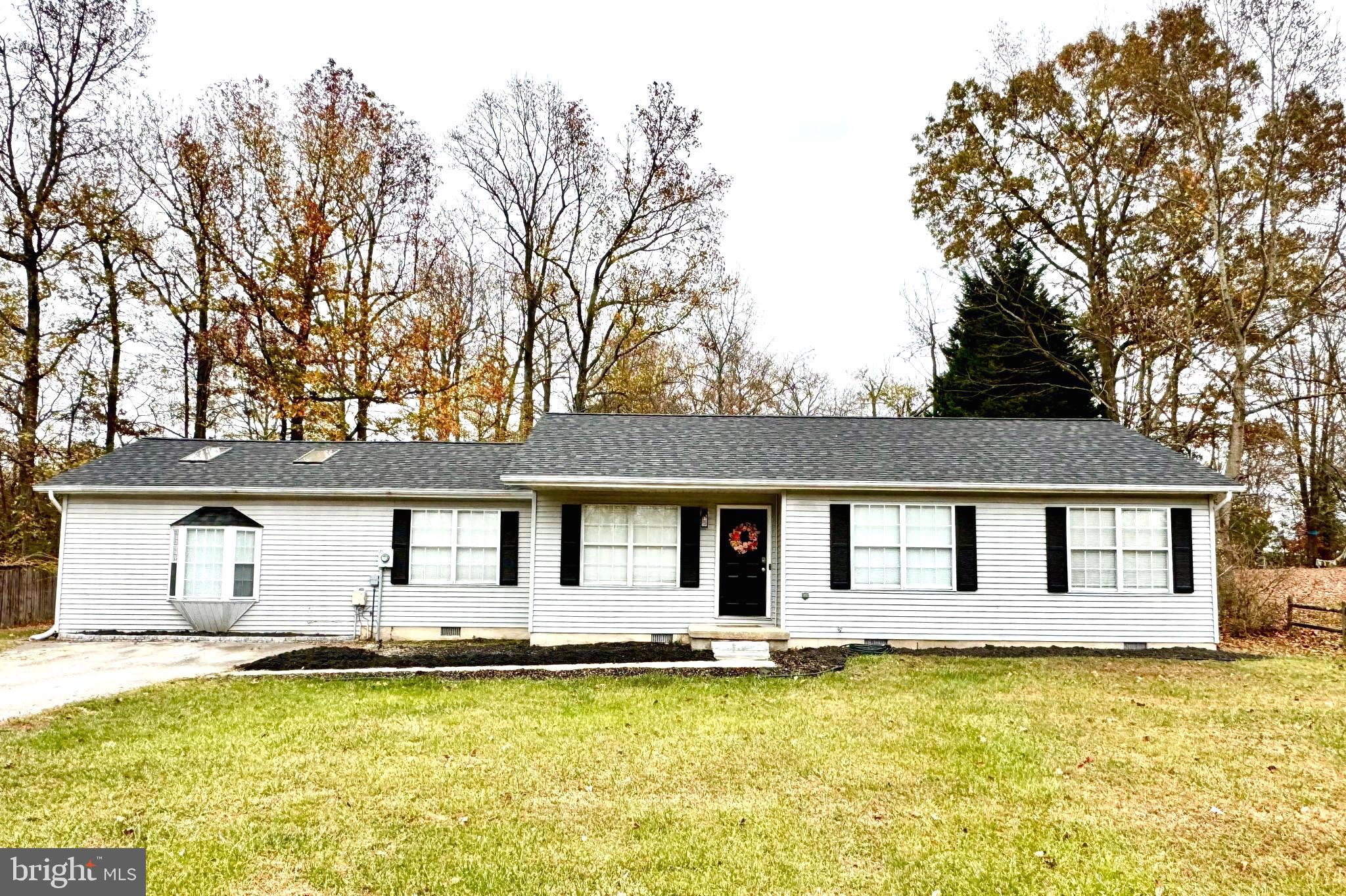 a front view of a house with swimming pool and porch