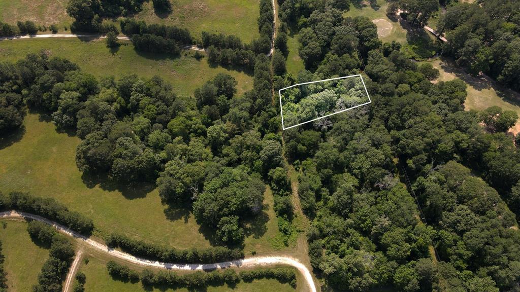 an aerial view of house with yard swimming pool and outdoor seating