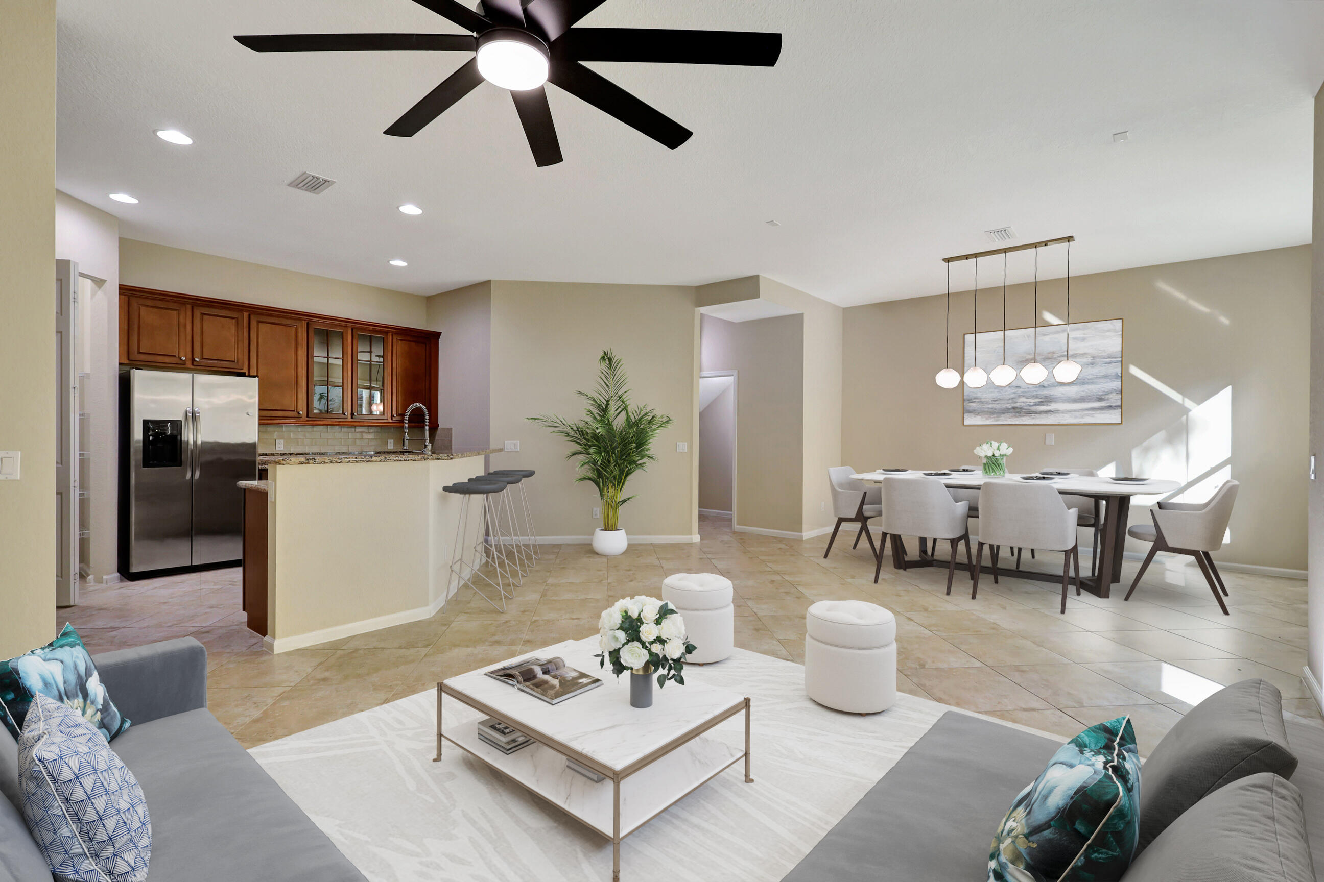 a living room with furniture and kitchen view