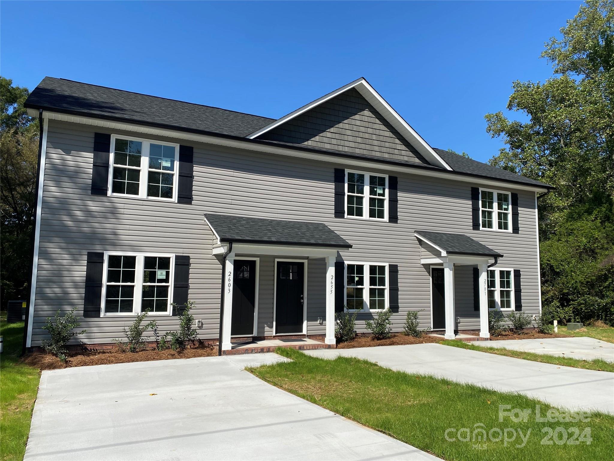 front view of a house with a yard