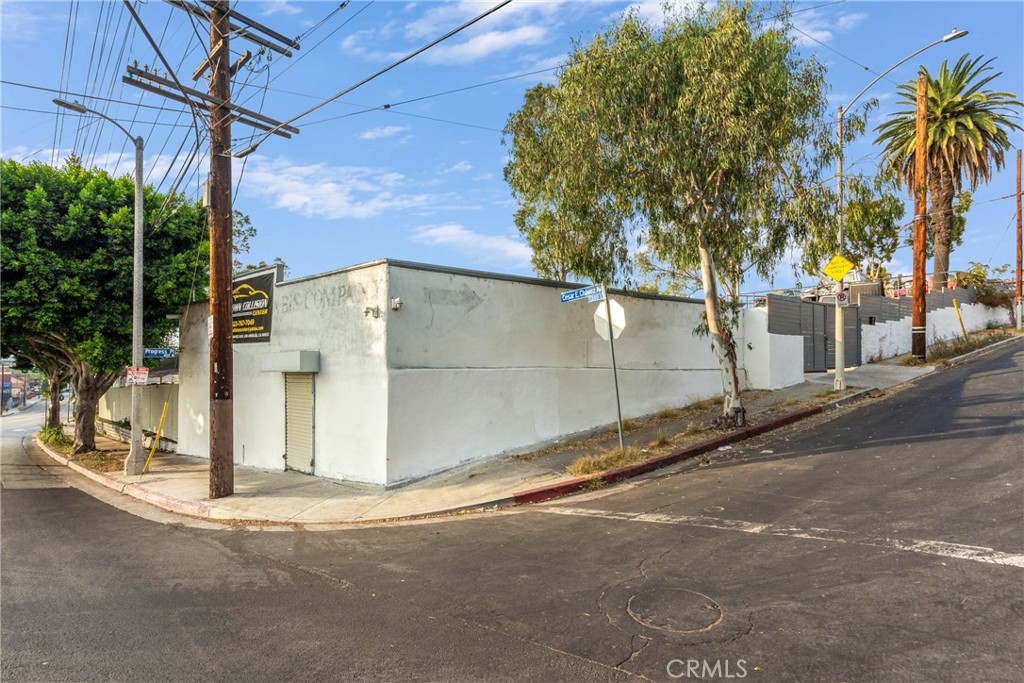 a view of a street with a garage