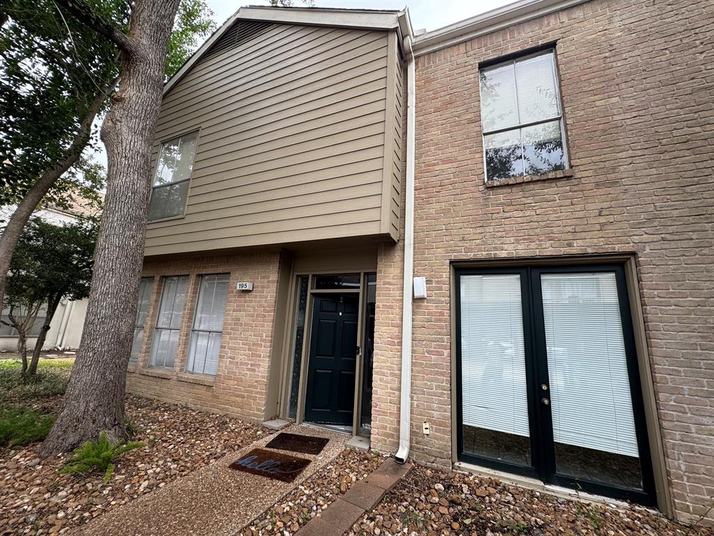 a front view of a house with a glass door