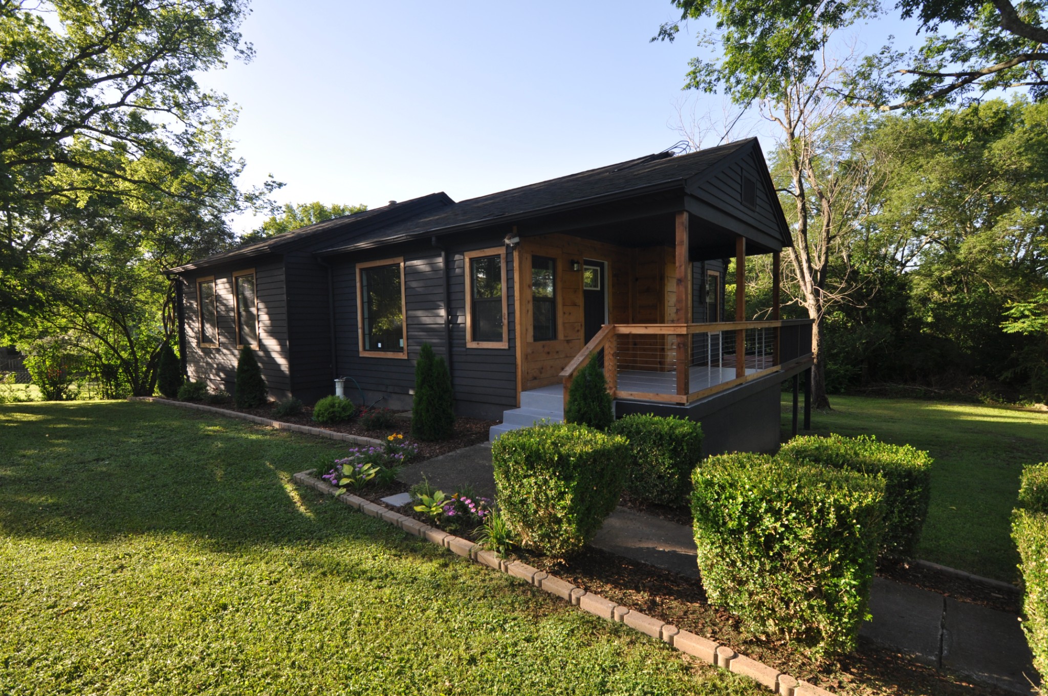 a front view of a house with garden