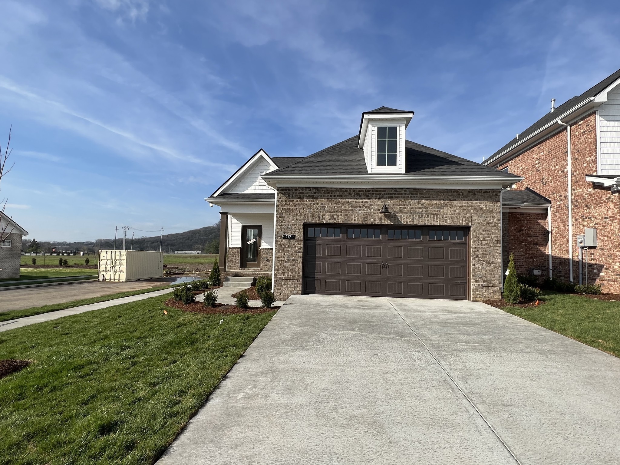 a front view of a house with a yard