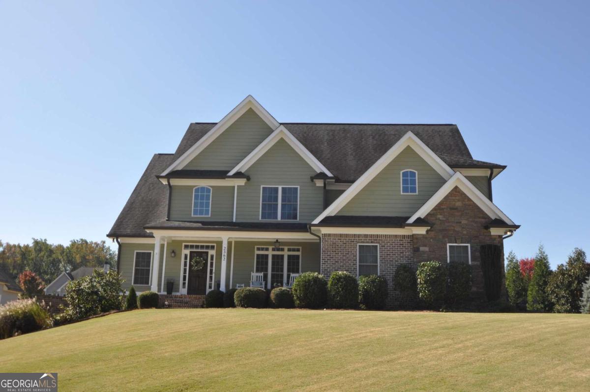 a front view of a house with a yard