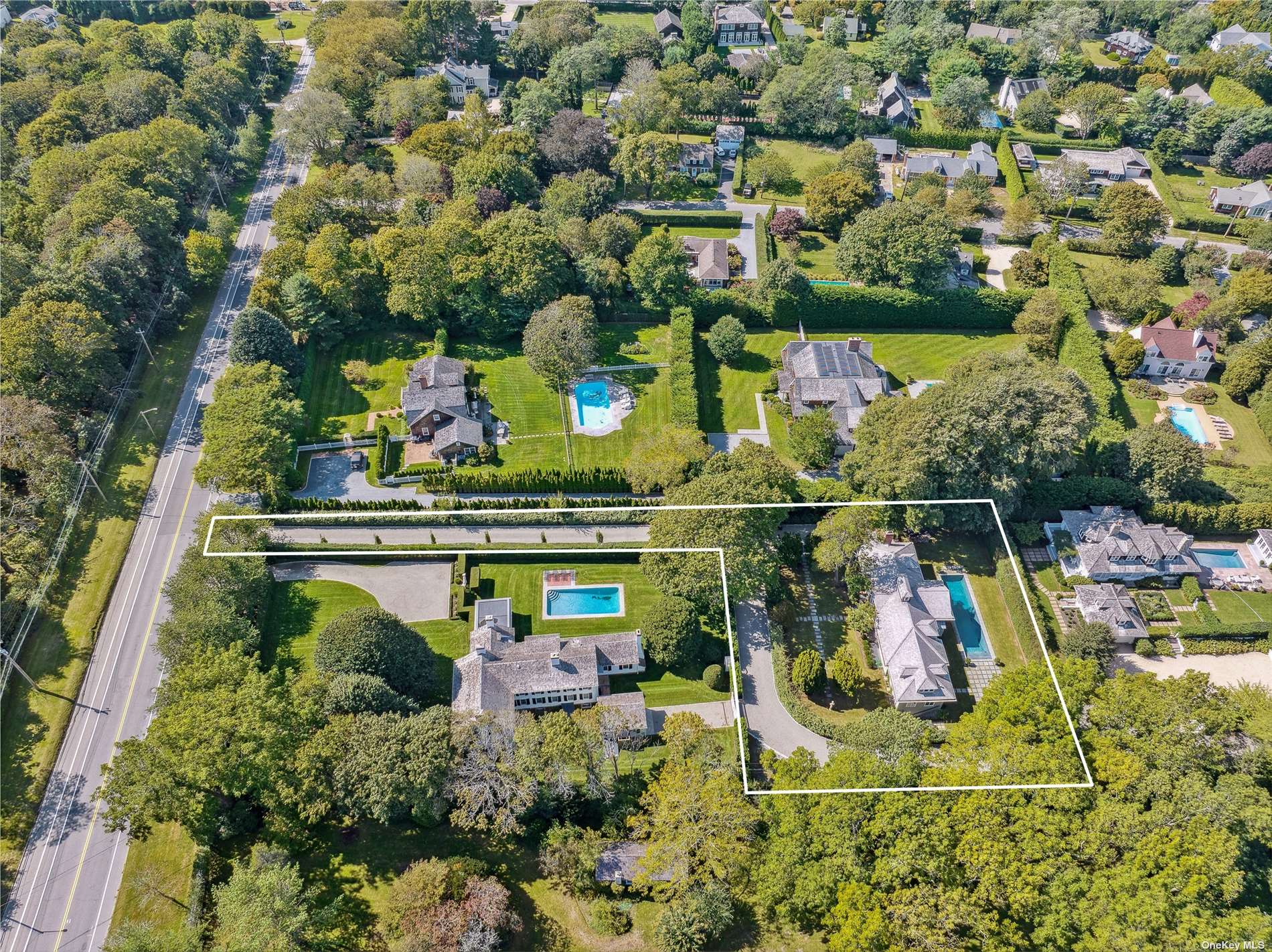 an aerial view of houses with yard