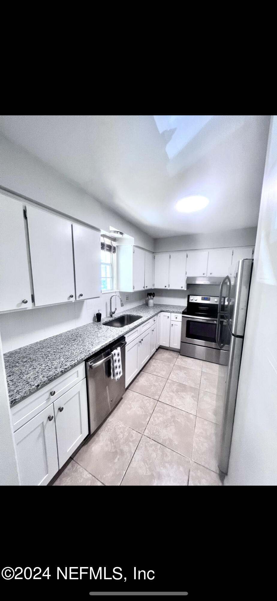 a view of kitchen with counter top space