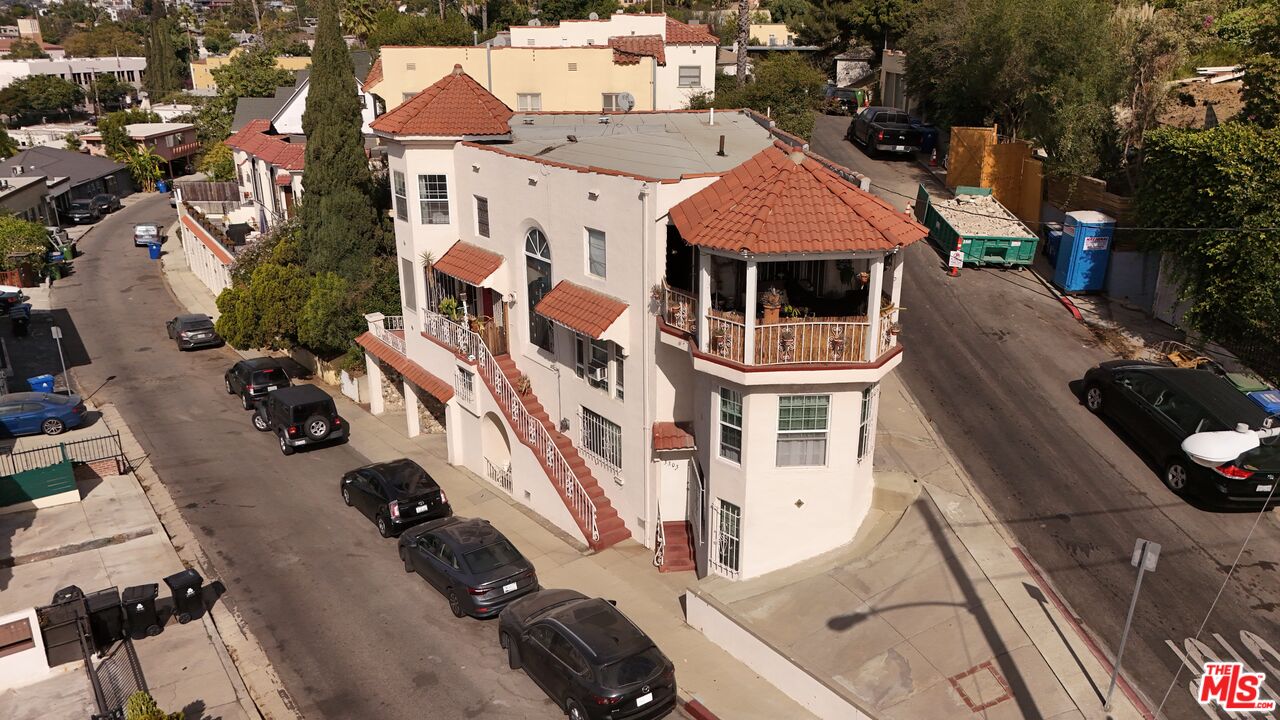 an aerial view of residential houses with outdoor space