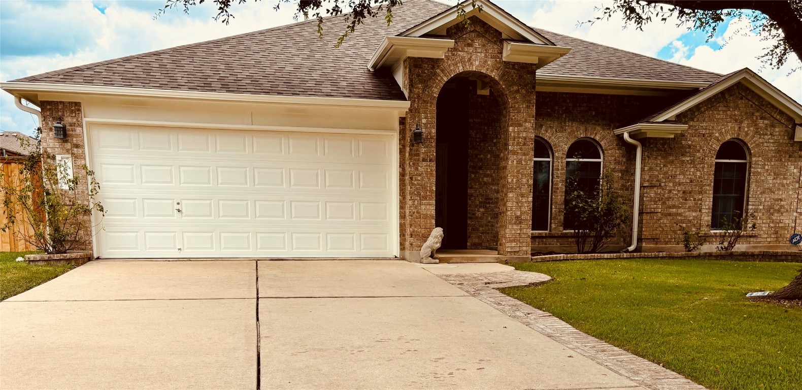 a front view of a house with a yard