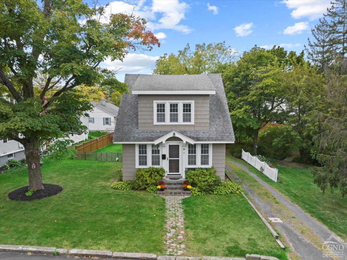 a front view of a house with a yard