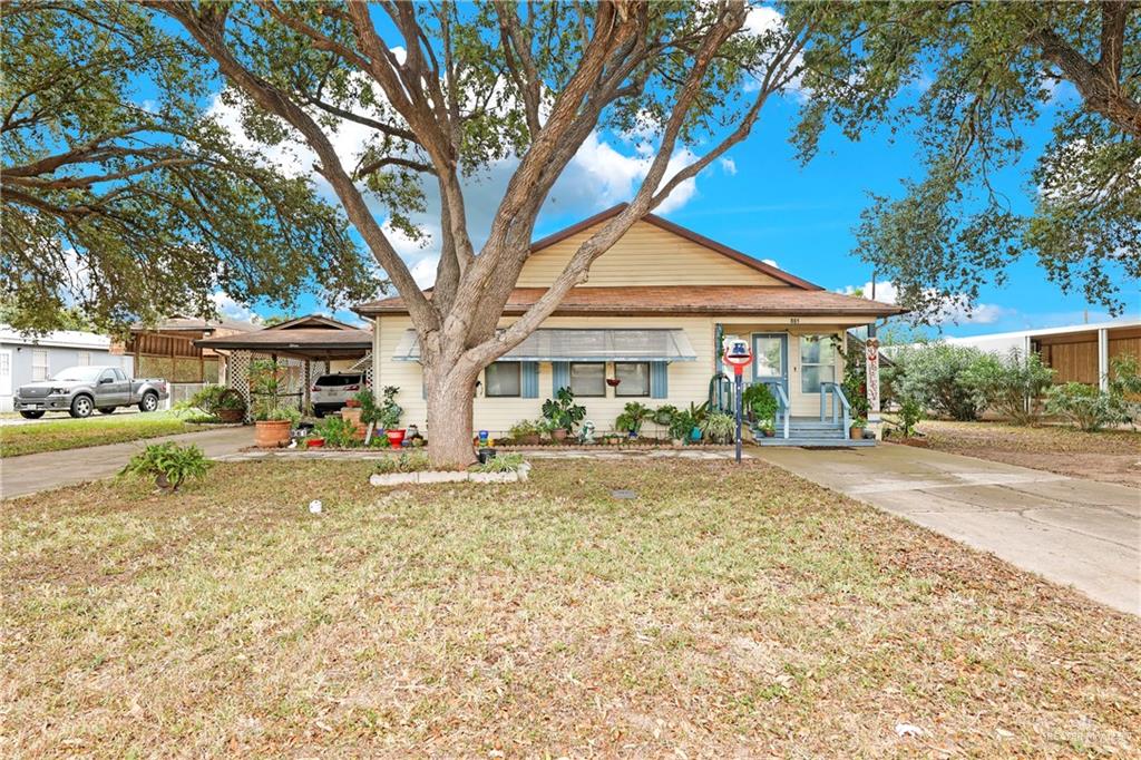 a front view of a house with a yard and porch