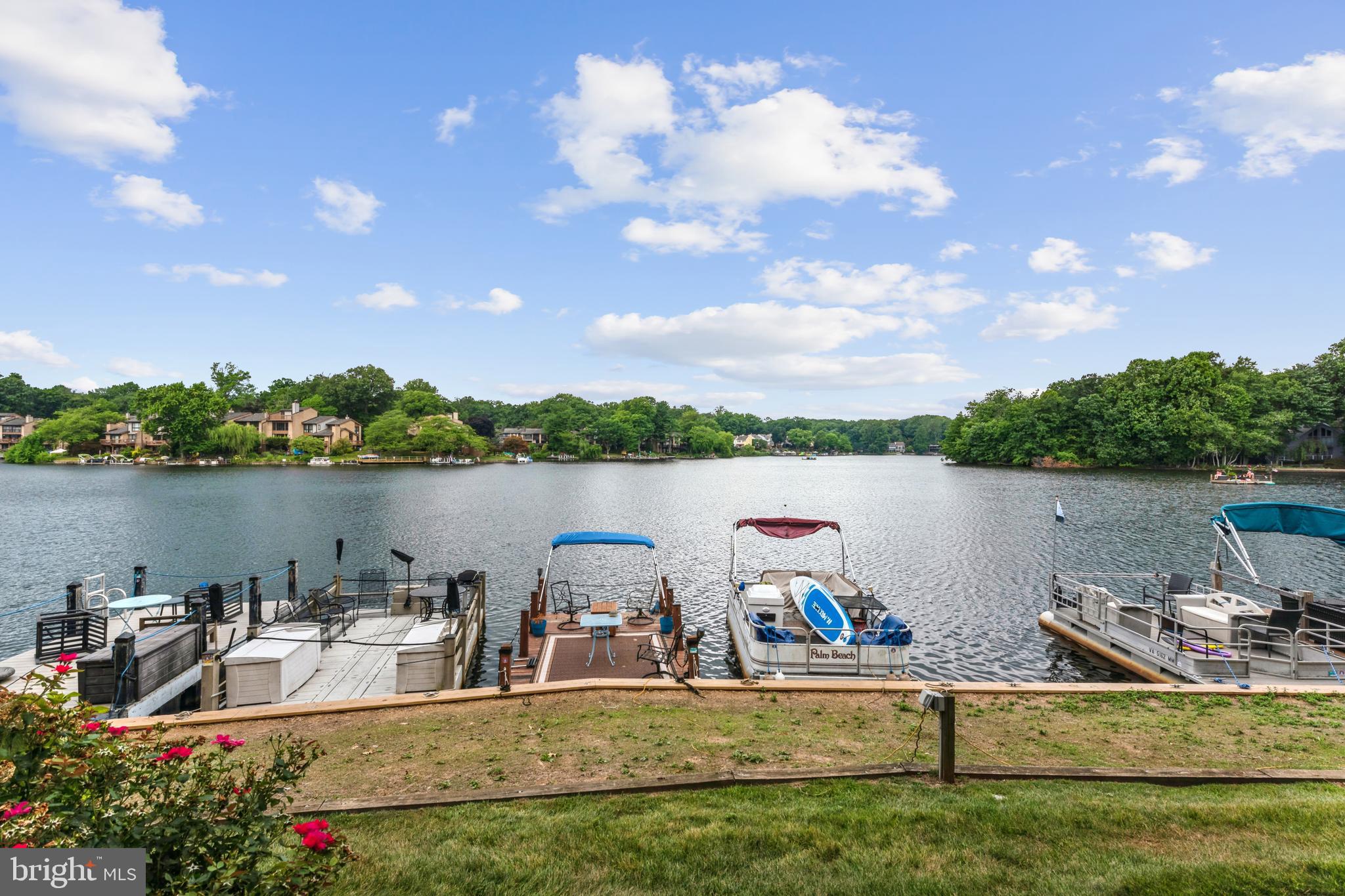 a view of a lake with houses in the back