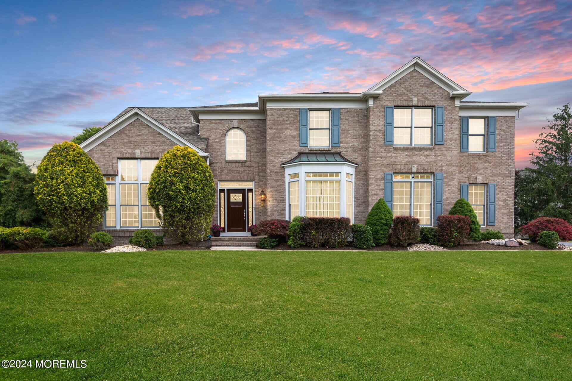 a front view of a house with a yard