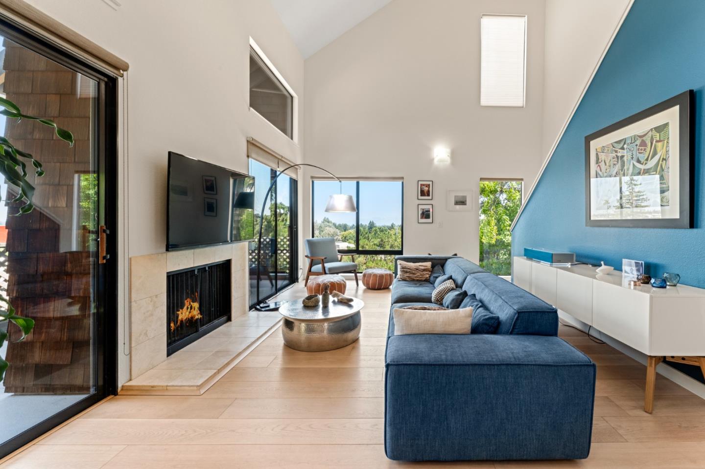 a living room with fireplace furniture and a flat screen tv